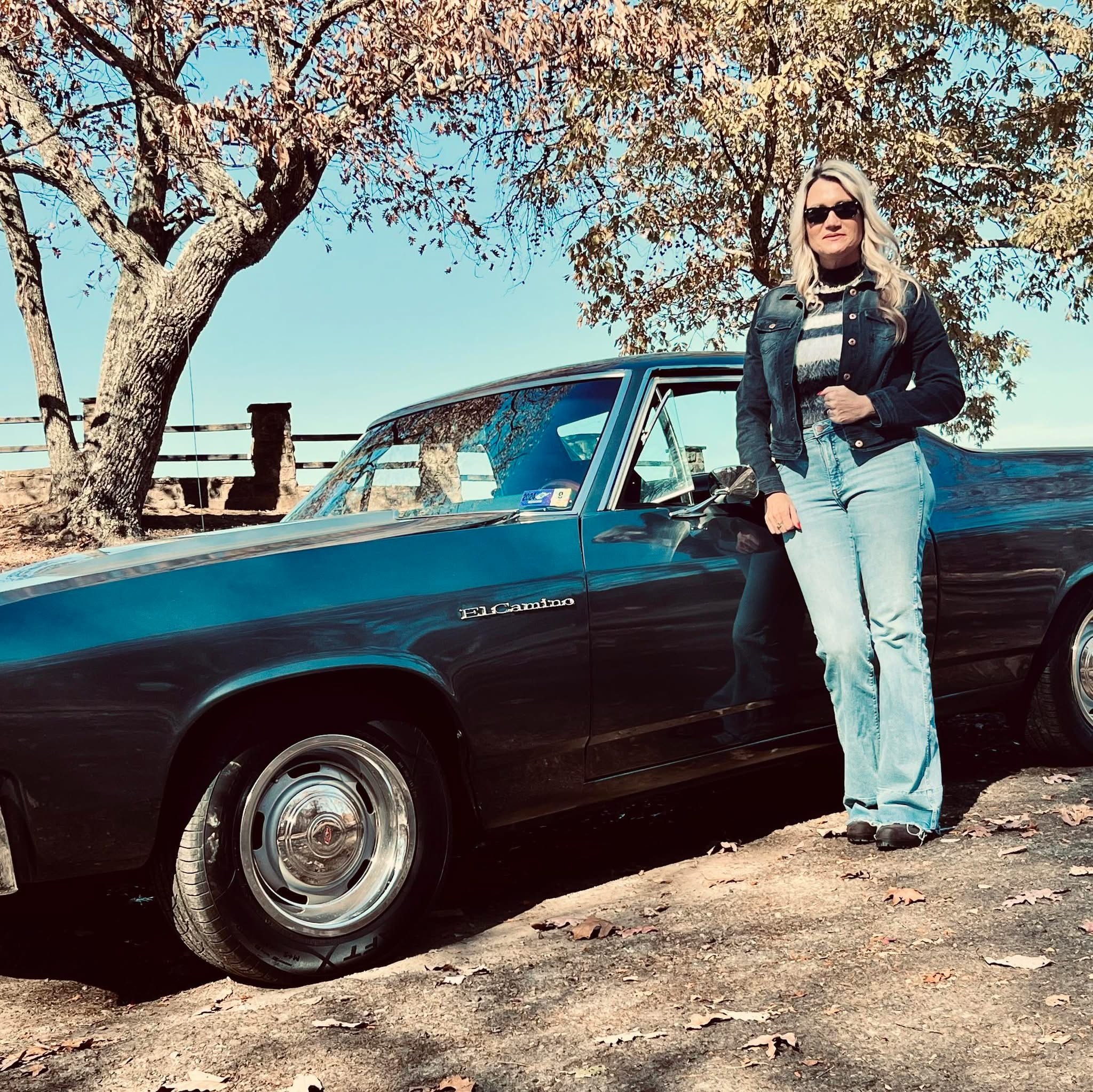 Cyndi Owens with a classic Chevrolet El Camino