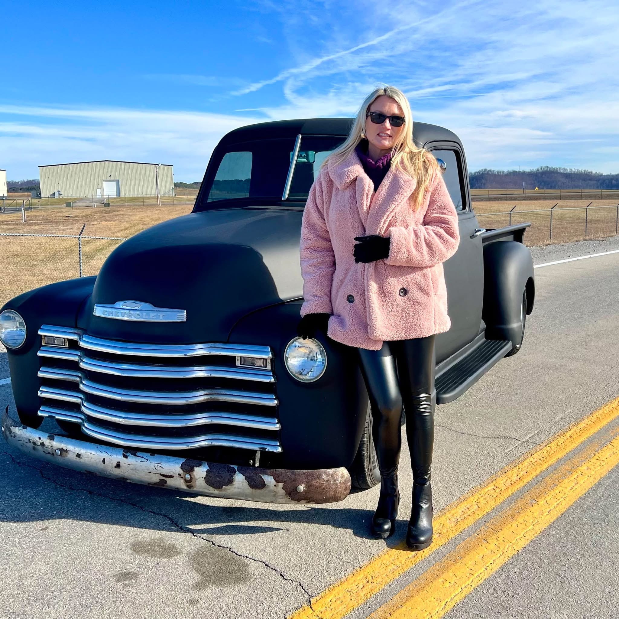 Cyndi Owens with a classic Chevrolet pickup truck